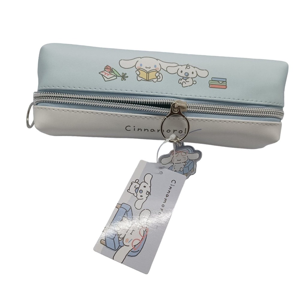 Sanrio cinnamoroll baby blue and pencil case with a charm.